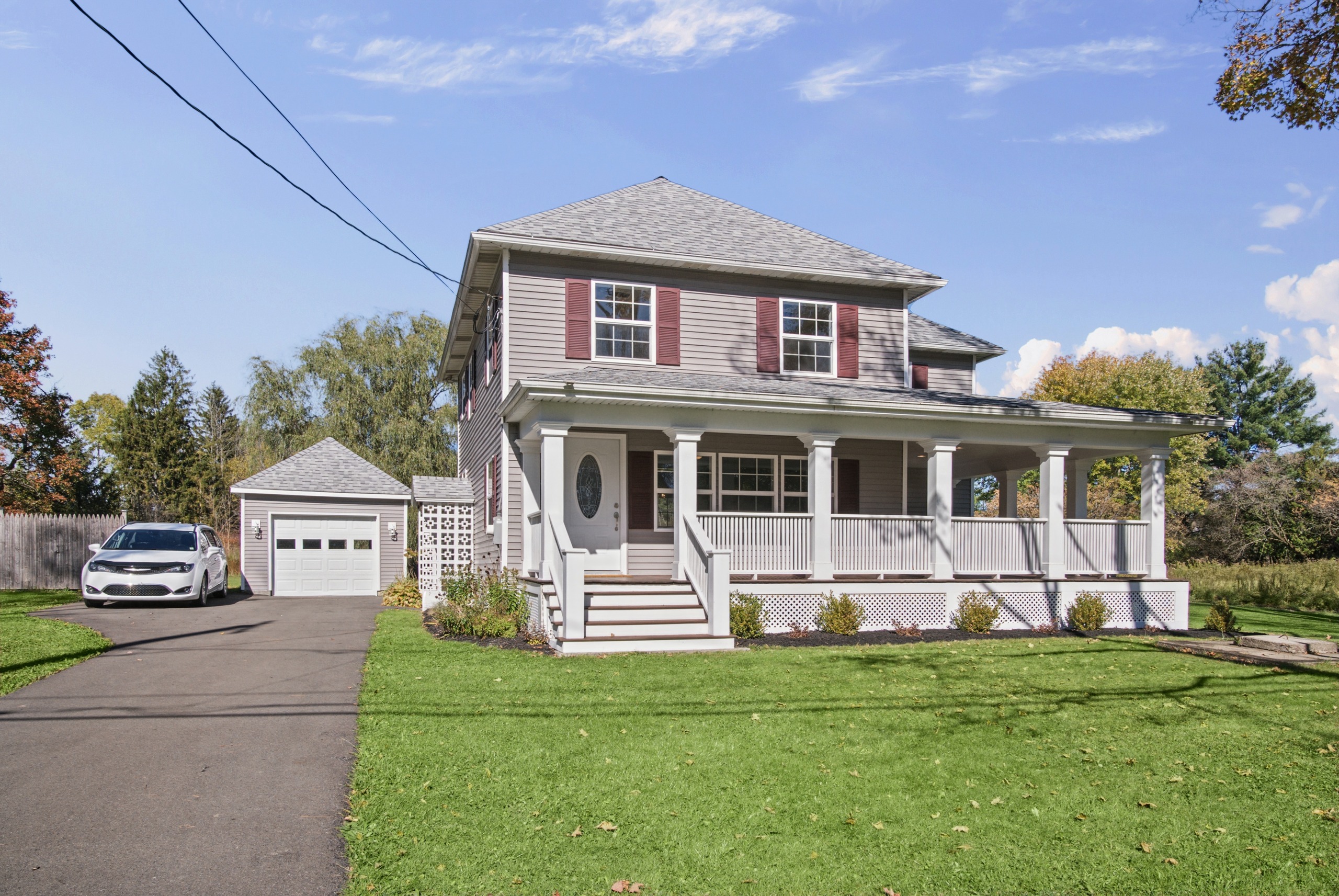 The wraparound porch and front exterior of 52 Etna Road